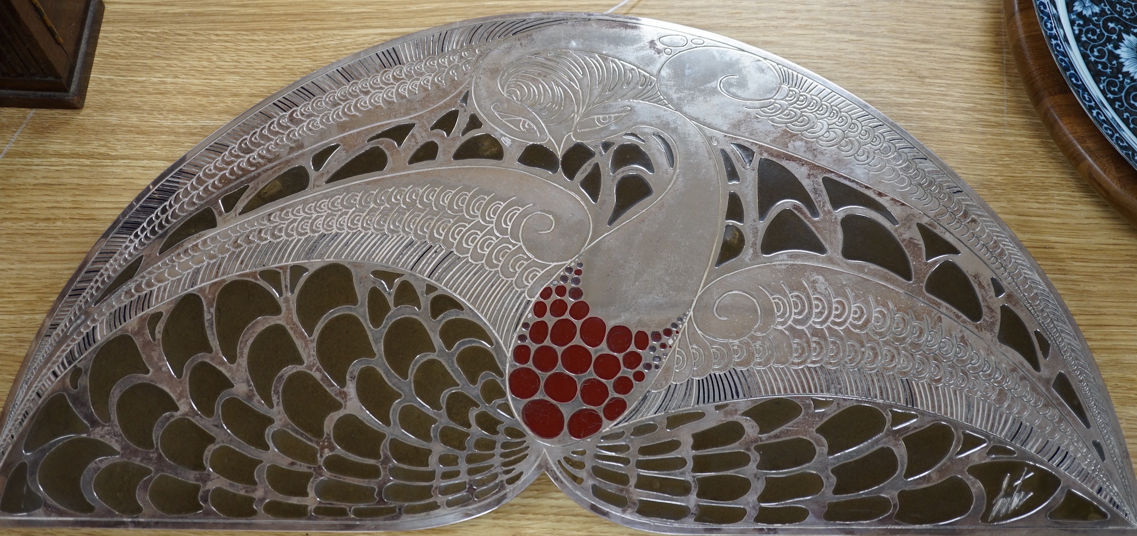 After Erte. A decorative panel or stand, with stylised decoration, 62cm wide